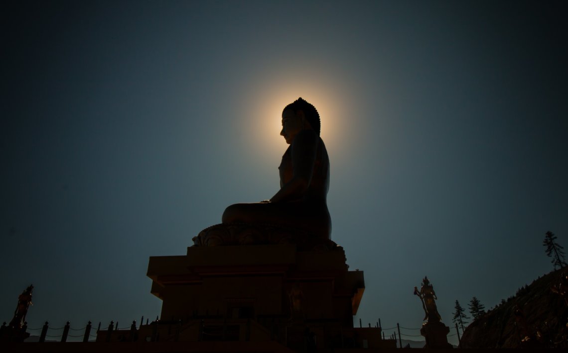 silhouette photo of Buddha statue